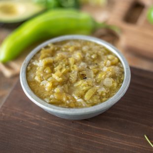 A pewter bowl filled with New Mexico Hatch Green Chile Sauce