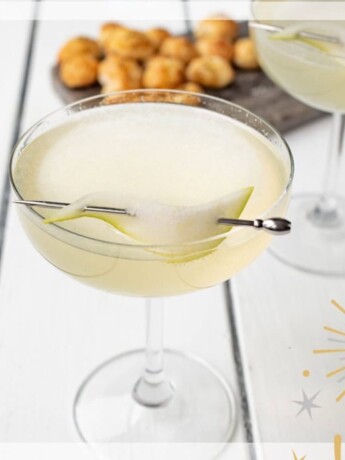 A champagne cocktail with a garnish