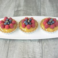 No bake berry lemon tartlets are an easy and very spring-like dessert. With a lemon graham cracker crust, delicious lemon curd filling and topped with fresh berries these tartlets are brightly colored berry treats.