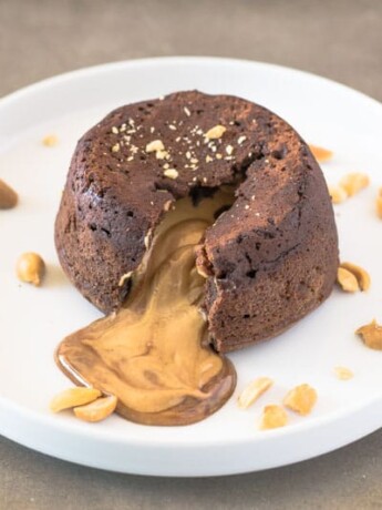 Creamy peanut butter running out from the inside of a chocolate lava cake