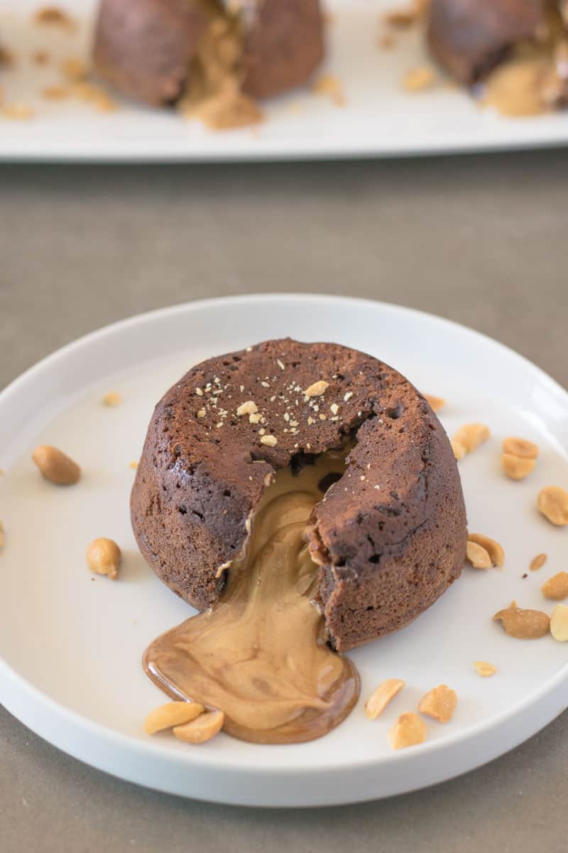 Peanut butter oozing out from the center of a chocolate lava cake