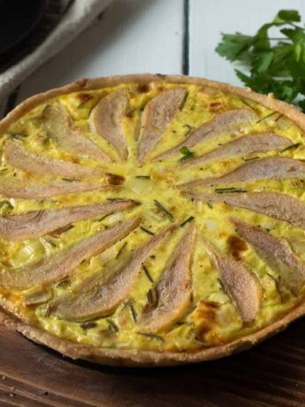 Pear slices fanned on top of a quiche