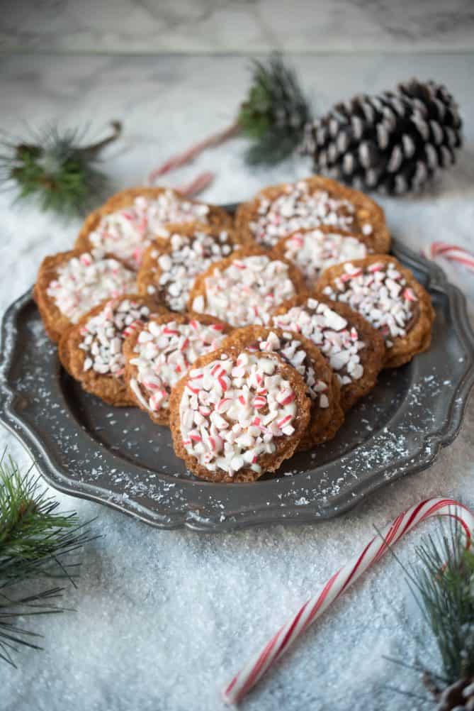 White and milk chocolate Florentine cookies topped with crushed candy canes