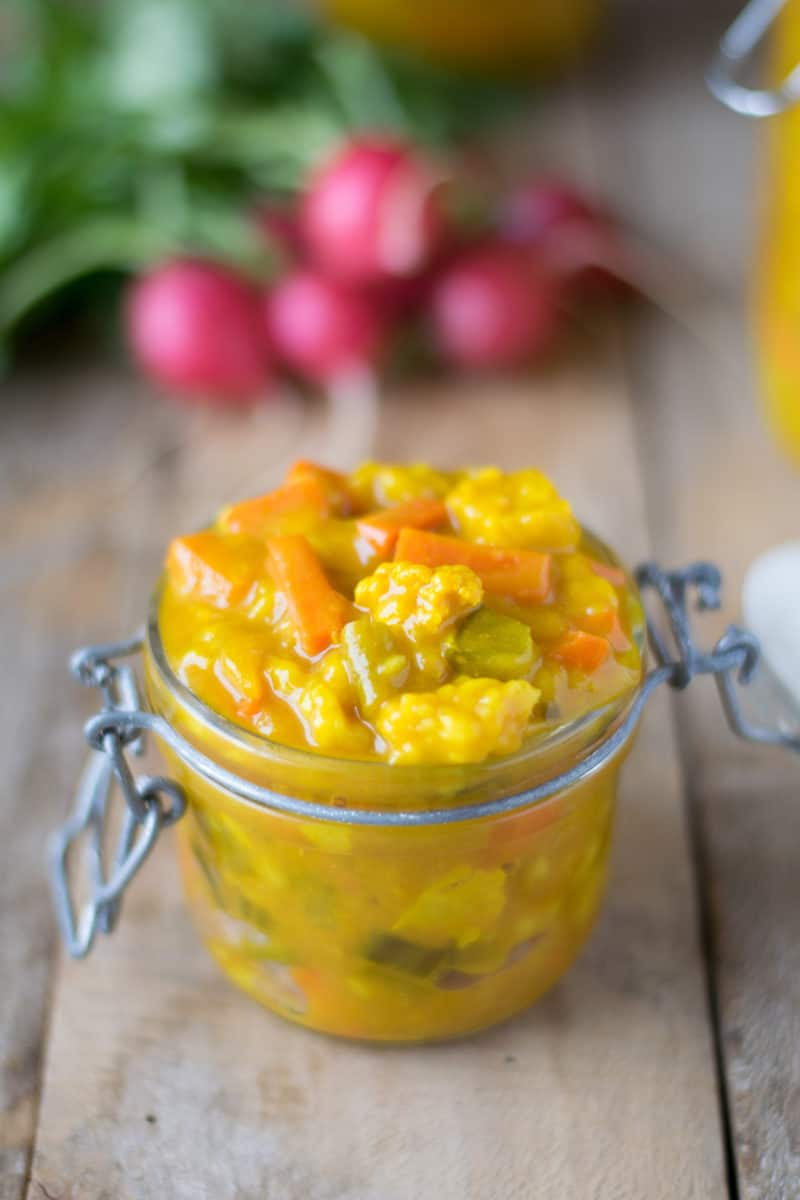 Piccalilli in a jar served with fresh radishes