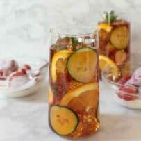 A glass of Pimm's No. 1 cup served with strawberries and cream for Wimbledon