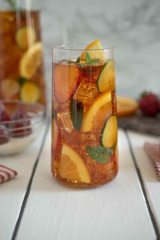 A side view of Pimm's with ice and fruit