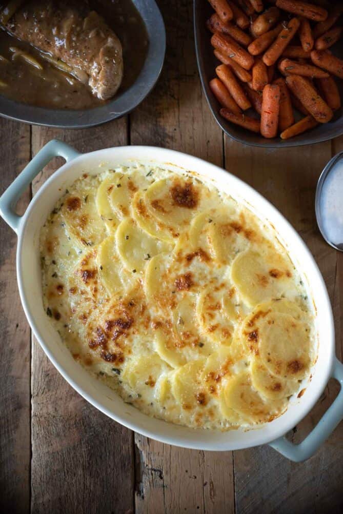 Browned and bubbly gratin with pork and carrots