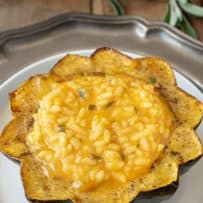 Half of an acorn squash filled with pumpkin risotto