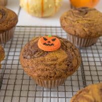 A pumpkin nutella muffin with a candy pumpkin on top