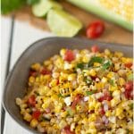 Charred corn kernels mixed with tomatoes and onion