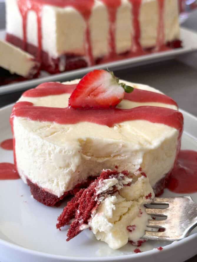 A round semifreddo ice cream cake with red velvet cake on the bottom