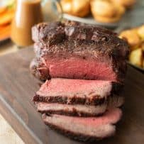 Sliced roast beef on a serving board