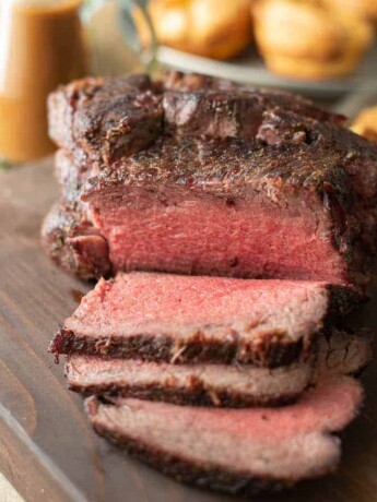 Sliced roast beef on a serving board