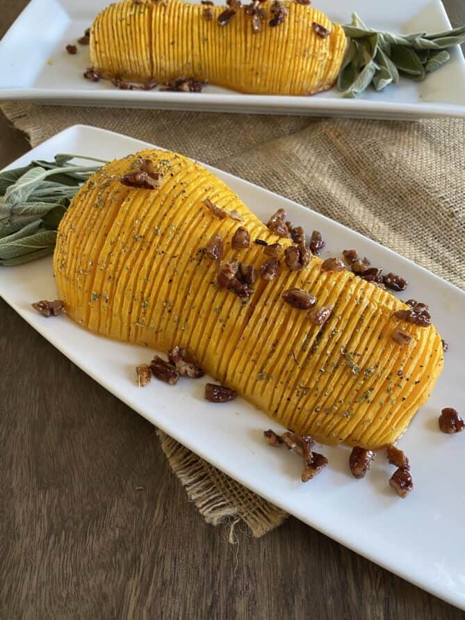 Maple pecans topping a roasted butternut squash half