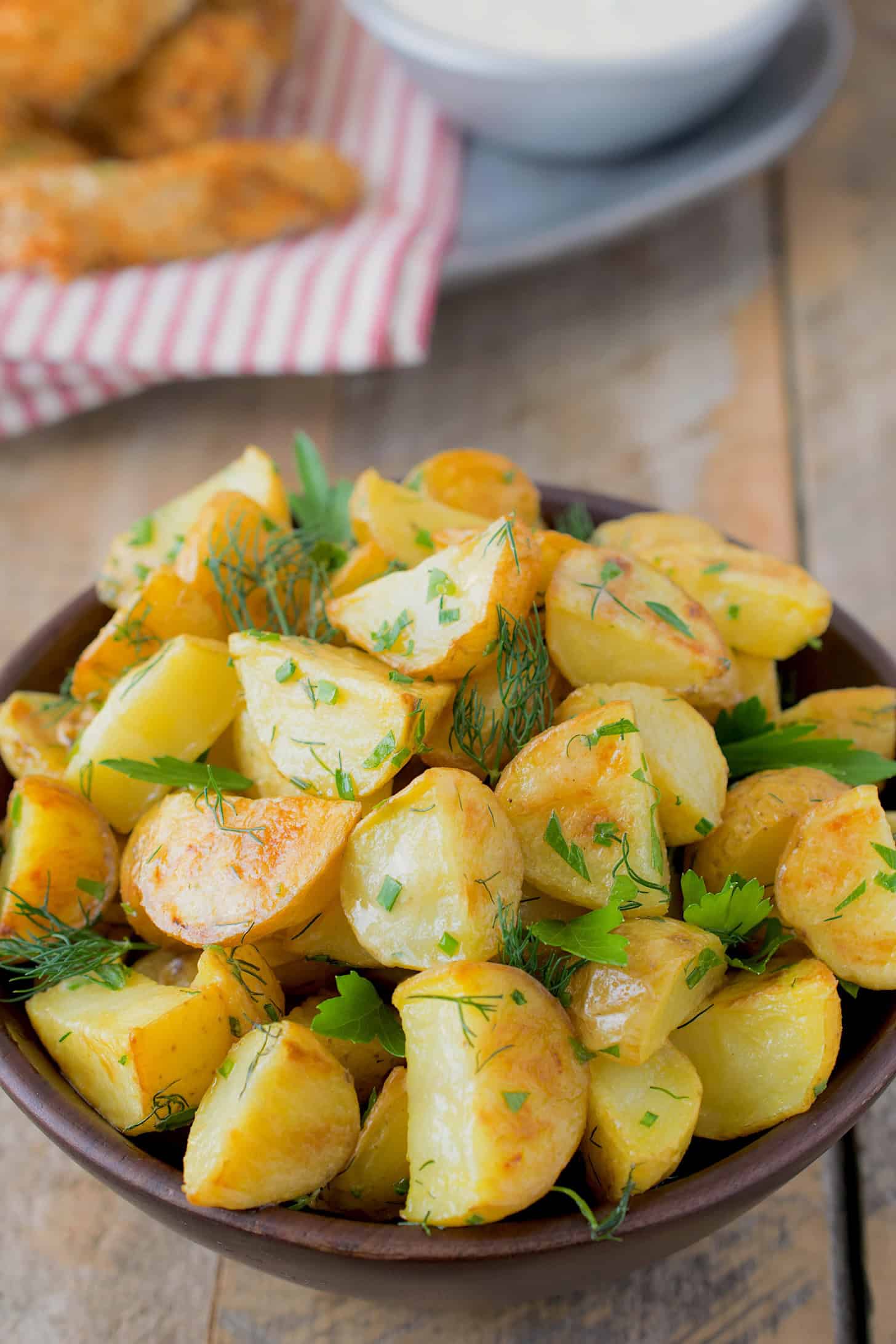 A closeup of potato salad with herbs
