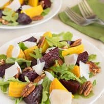 Red and gold beets with arugula, pecans and shaved cheese