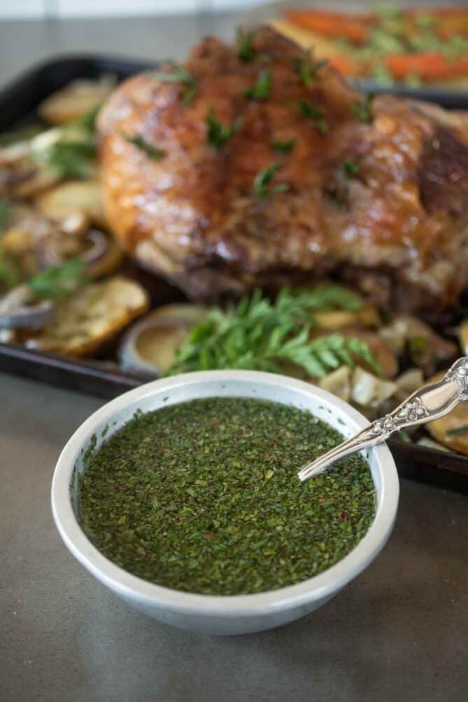 A bowl of mint sauce with roast lamb