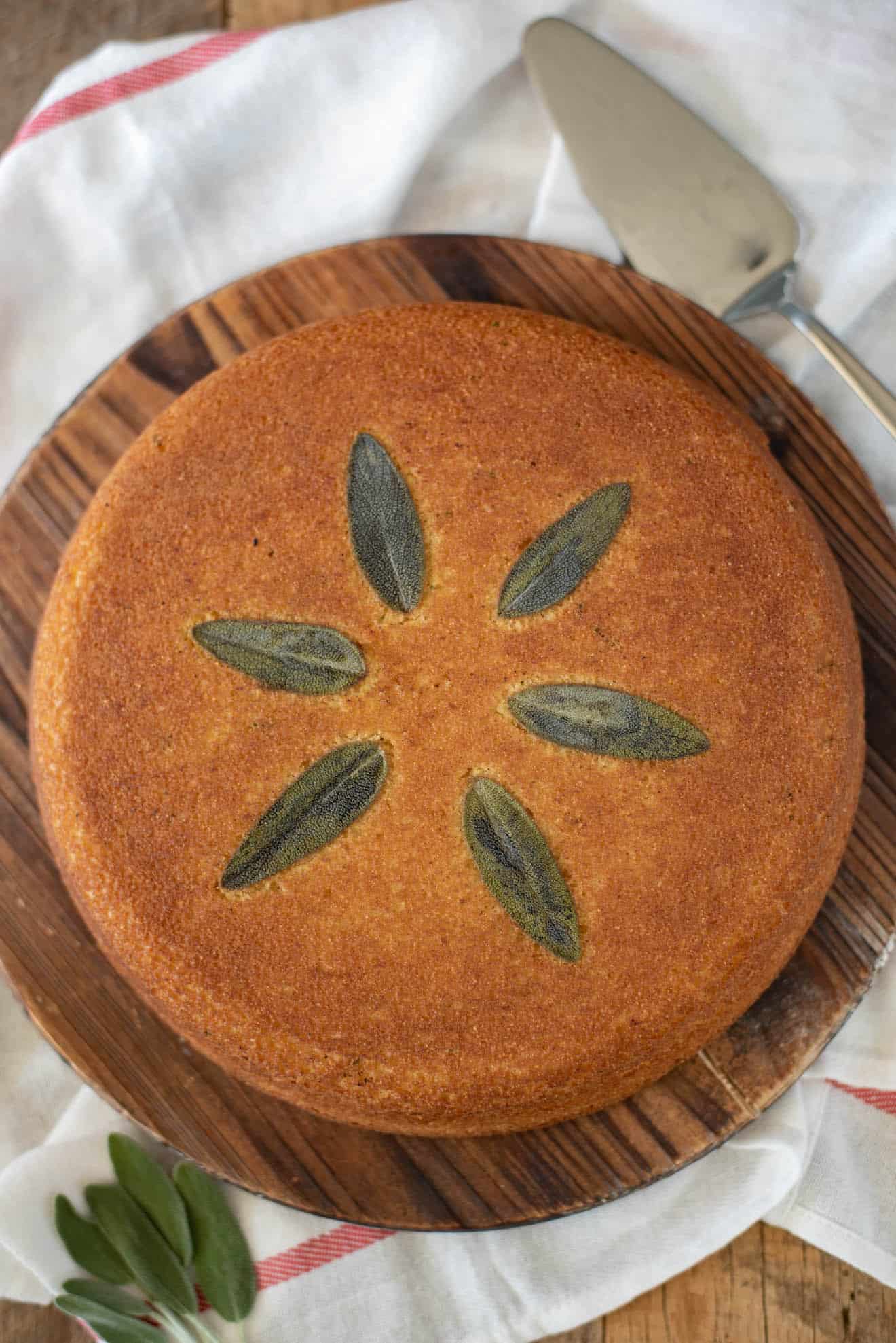 An overhead view of Sage Cornbread garnished with whole sage leaves
