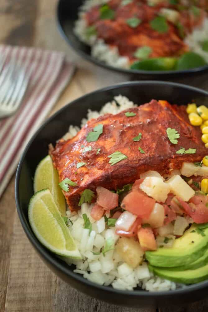 A closeup of the salmon showing the al pastor sauce garnished with cilantro