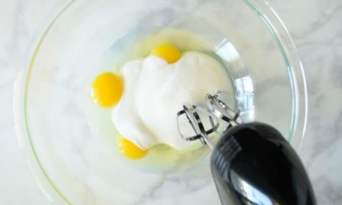 Whisking sugar into eggs