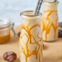 Salted Caramel Date Shake in a glass bottle with straws