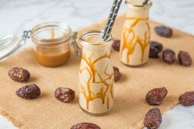 Salted caramel drizzled jars filled with salted caramel milkshake with dates