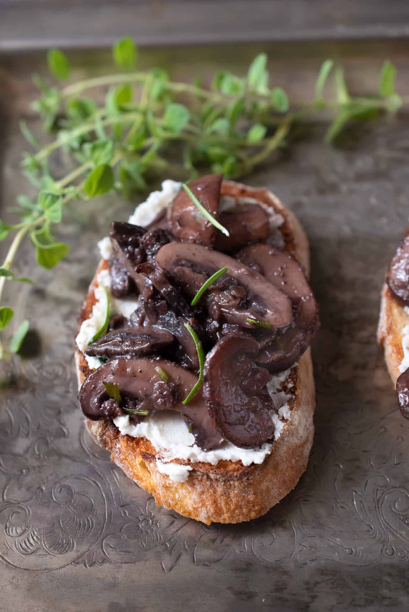Sautéed mushrooms and rosemary with ricotta cheese on crusty bread