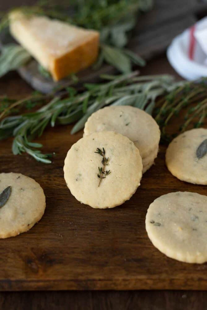 A sprig of thyme decorating the top of a cracker