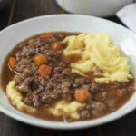 Creamy mashed potato topped with ground beef and gravy