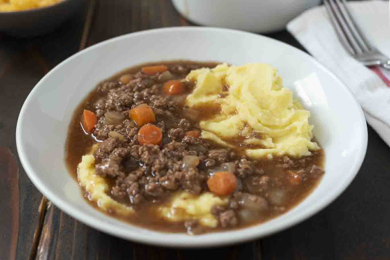 Creamy mashed potato topped with ground beef and gravy