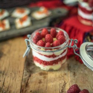 Scottish raspberry trifle dip in a sealable glass jar ready to be taken on a picnic