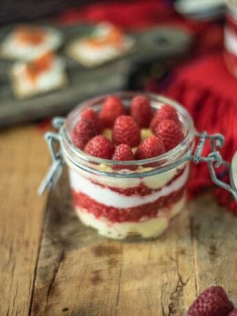 Scottish raspberry trifle dip in a sealable glass jar ready to be taken on a picnic