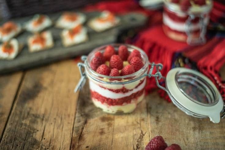 Scottish raspberry trifle dip in a sealable glass jar ready to be taken on a picnic