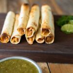 Rolled up tortillas filled with shredded chicken