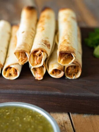 Rolled up tortillas filled with shredded chicken