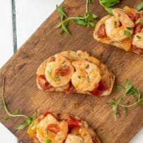 3 Shrimp and Cherry Tomato Bruschetta on a serving board