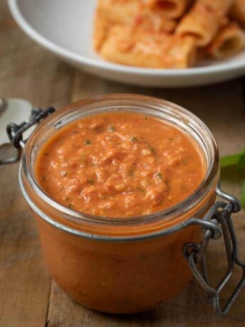 A jar filled with Sicilian Tomato Pesto Sauce
