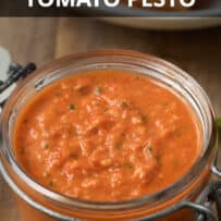 Chunky tomato pesto sauce in a glass jar
