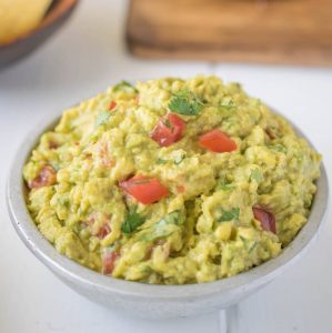 Signature guacamole, fresh avocados are mashed with fresh lime juice, fresh cilantro, chopped tomato and chipotle tabasco for a little kick.