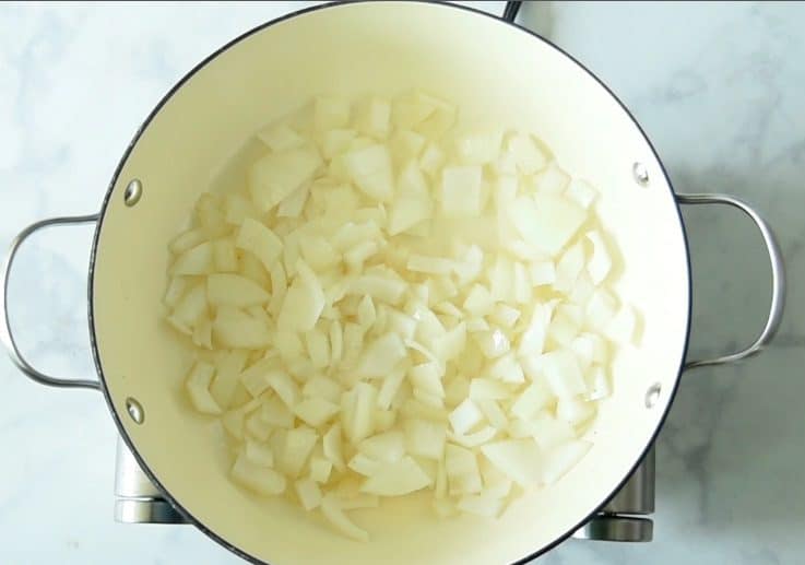 Onions and garlic are softened in a pan