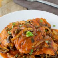 Chicken cacciatore with mushrooms, capers and onions in tomato sauce