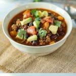 Slow cooker beef and sweet potato chili is everyones favorite comfort food that is made seasonal by adding sweet potato. Let the slow cooker to the work and all you have to do add your favorite toppings and enjoy!