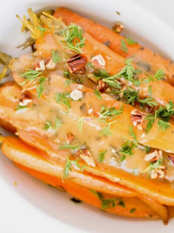 Glazed carrots viewed from overhead in an oval bowl