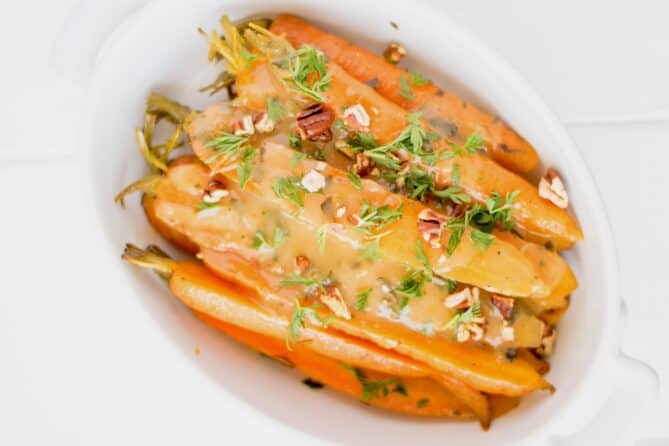 Glazed carrots viewed from overhead in an oval bowl