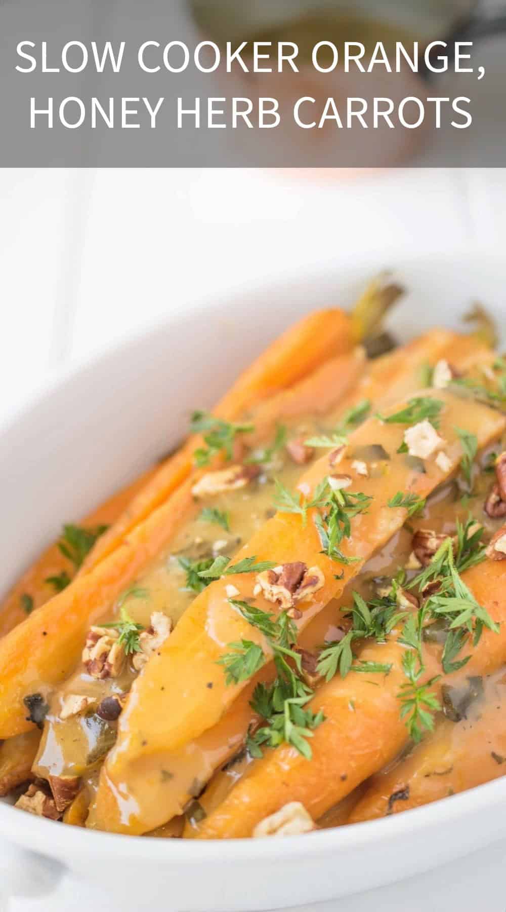 Chopped pecans and herbs on top of sliced carrots
