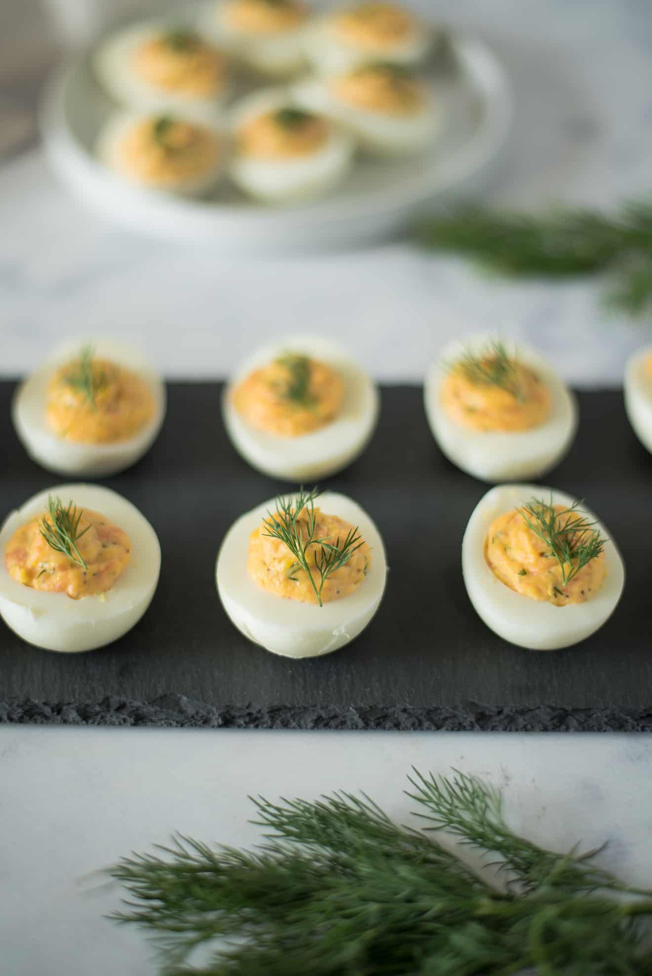 Smoked Salmon Deviled Eggs on a slate platter