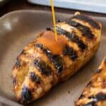 2 grilled chicken breasts with sauce
