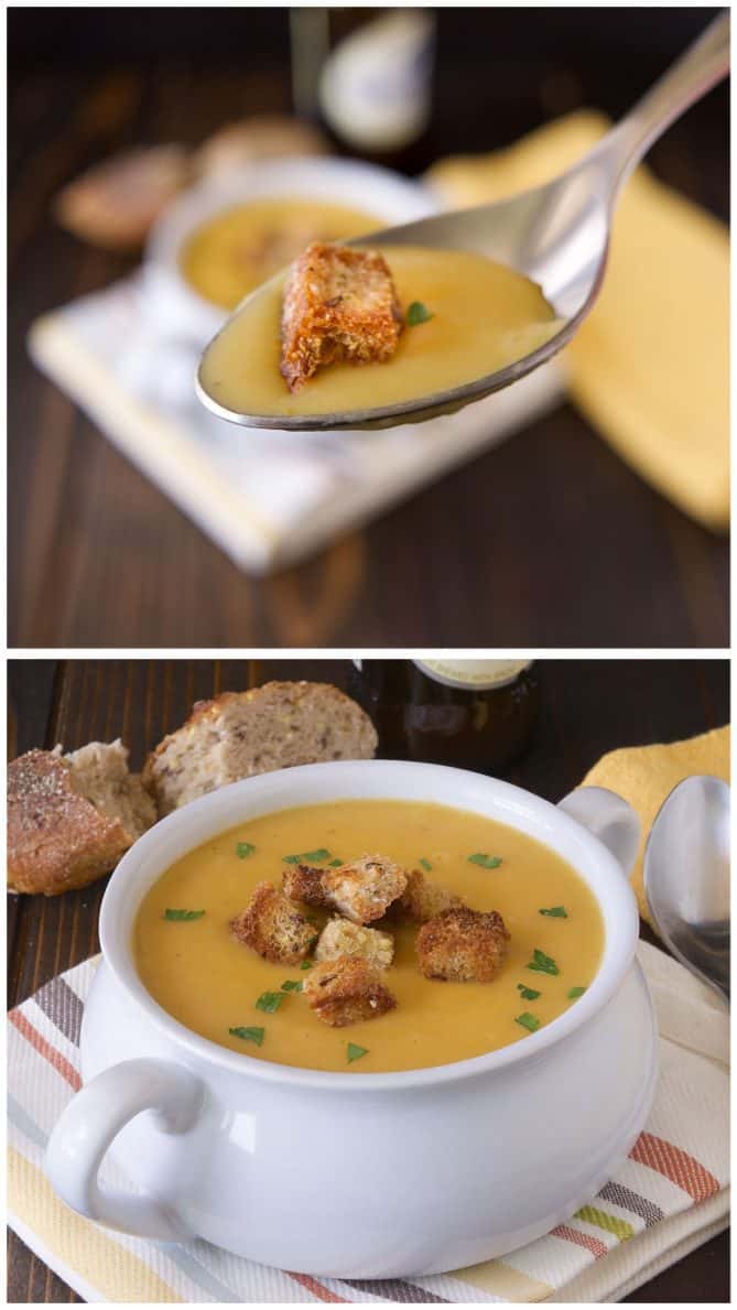 A closeup of a spoonful of soup and a crouton and a bowl of beer soup