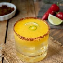 Spicy Jalapeño Mango Margarita with chili peppers and lime