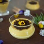 Orange custard in a glass bowl